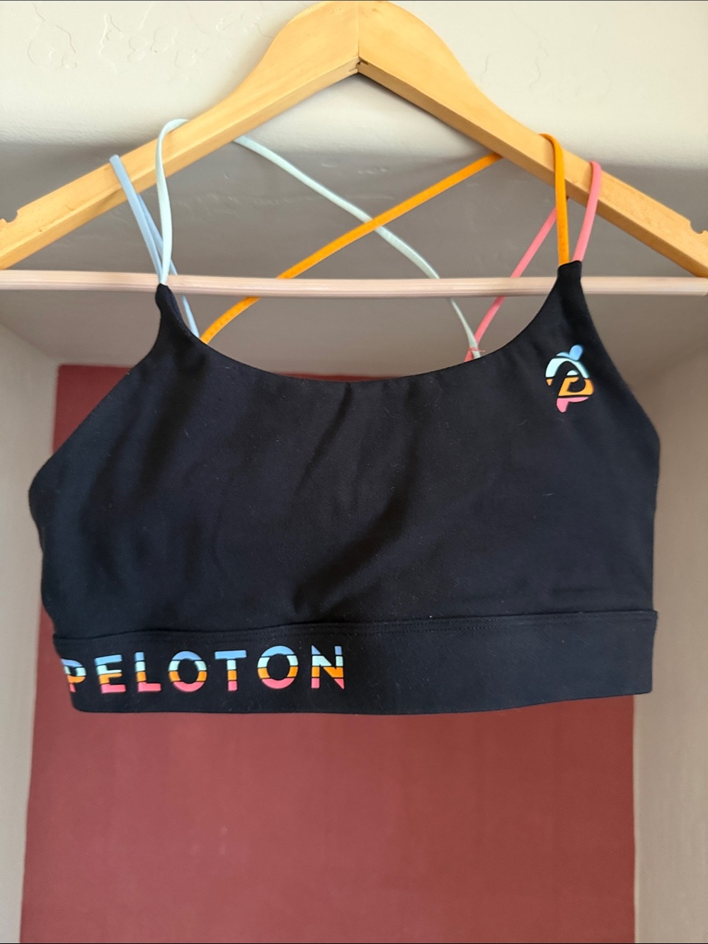 Peloton Black Sports Bra with Pink, Blue, Yellow and Cream Straps